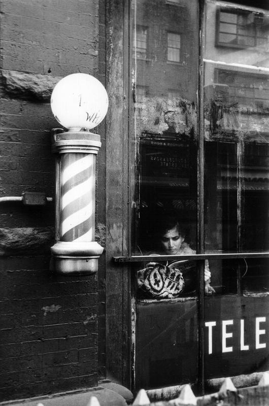 Woman and Barber Pole, photograph by Bernard Safran